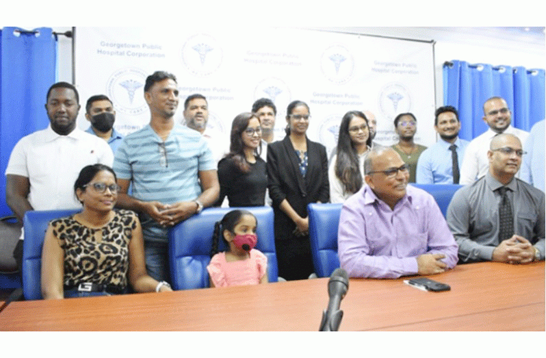 Patient Angelica Soamnauth and family with the medical team and Health Minister Frank Anthony