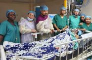 The GPHC's Vascular Surgery team, led by Consultant Vascular Surgeon Dr. Carlos Martin with the patient during the recovery period (GPHC photo)