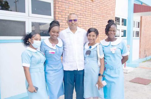 Minister of Health Dr. Frank Anthony, presents one of the nurses with a plaque at the appreciation ceremony held in observance of International Nurses Day 2025