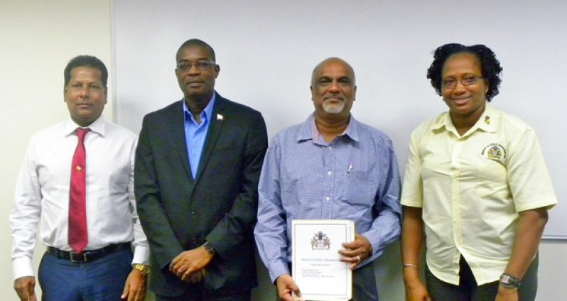 Minister of Public Infrastructure, Honourable David Patterson (second, left) and Minister within the Ministry, Honourable Annette Ferguson (right) with GPL Chairman, Robert Badal (left) and GPL Board Member, Komal Ramnauth (second, right)