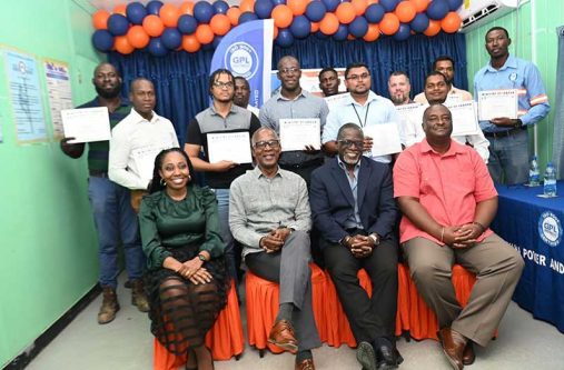 (seated from left) Co-owner and Manager of Rehoboth Workforce Development Centre, Sherissa Phillips; Minister of Labour, Joseph Hamilton; Deputy Chief Executive Officer for Support Services at GPL, Renford Homer; Human Resource Development Manager at GPL, Anthony Johnson and some of the graduates of the Fibre Optic Installer and Technician Training programme