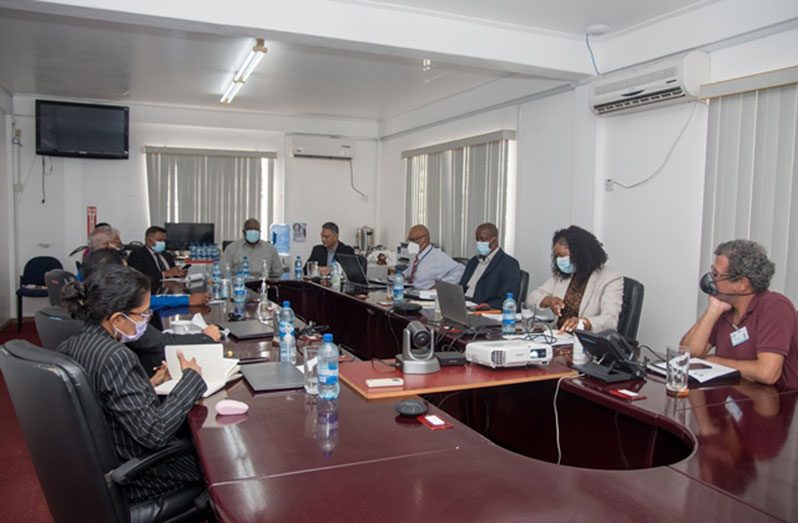 Prime Minister, Brigadier (ret’d) Mark Phillips (centre) and Minister within the Ministry of Public Works, Deodat Indar, along with members of GPL’s Board of Directors (DPI photo)