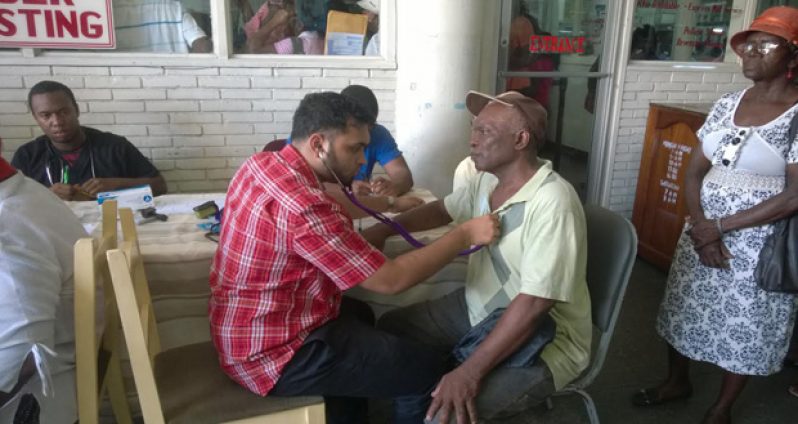 Pensioners being tended to by health personnel on Monday during the mini health clinic at the GPOC headquarters