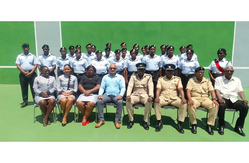 Chairman of the Prison Service Recruitment Board, Ronald Harsawack (seated fourth from left), next to Acting Deputy Director of Prisons, Kevin Pilgrim and other senior ranks, flanked by the new recruits