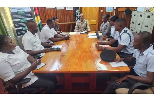 Director of Prisons, Nicklon Elliot (centre), with agriculture officers from various prison locations at the Prison Headquarters