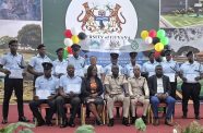 Director of Prisons Nicklon Elliot and Acting Deputy Director of Prisons, Kevin  Pilgrim, are flanked by some of the graduates and other officials at the graduation ceremony (GPS photo)