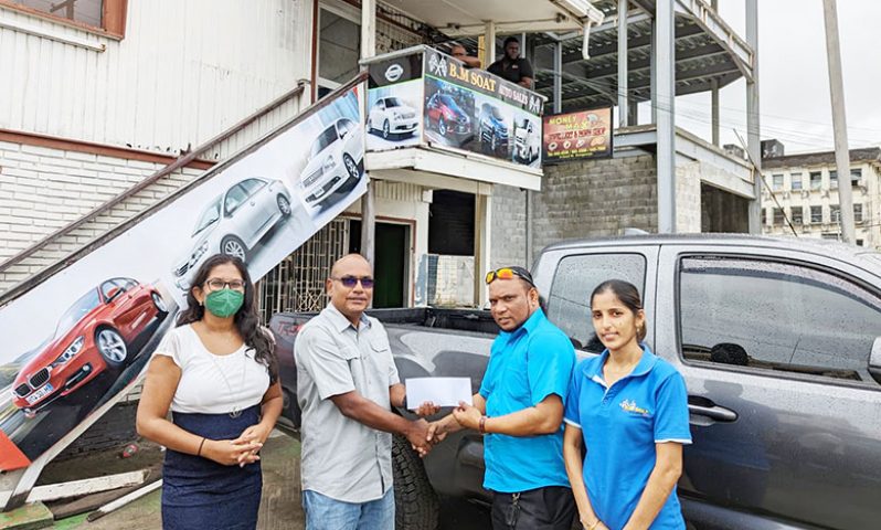 Captain Gary Sahai (second from left), Match Director receives sponsorship funds from Mr Vijay Desemangrazon , Manager of B.M. Soat Auto Sales in the presence of GSSF Secretary, Mrs Vidushi Persaud-McKinnon (extreme left) and Ms Mona Ruhoman, Supervisor of Sales Department, B.M. Soat Auto Sales.