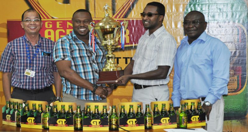 Petra Organisation Co-Director Troy Mendonca, flanked by officials from Banks DIH at yesterday’s launching.