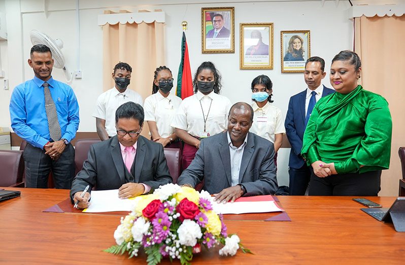 Minister of Education Priya Manickchand oversees  signing of the Memorandum of Understanding for the project at GTI’s Woolford Avenue compound (Ministry of Education photo)
