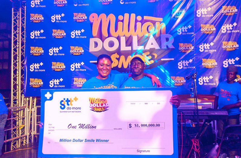 One Million Dollars richer! Maynard Carmichael (left) and GTT’s Marketing Manager Samantha Gooden (Delano Williams photo)