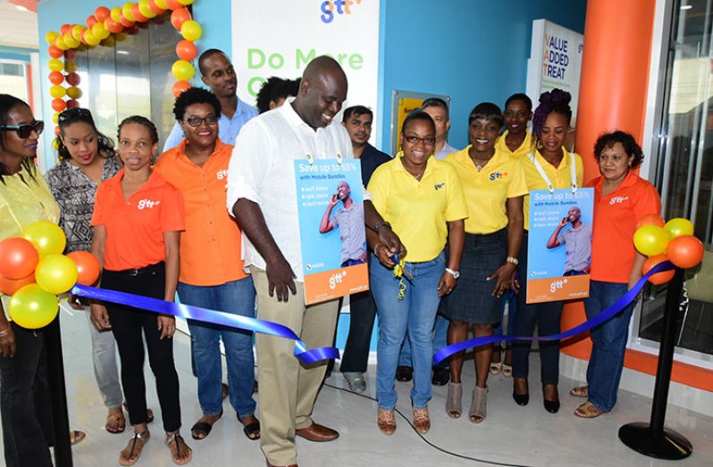GTT CEO, Justin Nedd, with the help of his staff cut the ribbon to symbolically declare the retail store open