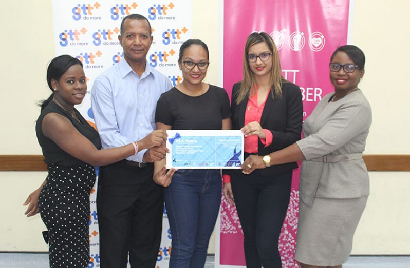 GTT’s Communications Officer, Crystal Stoll (centre) presenting a voucher to ‘Pinktober’ sponsors