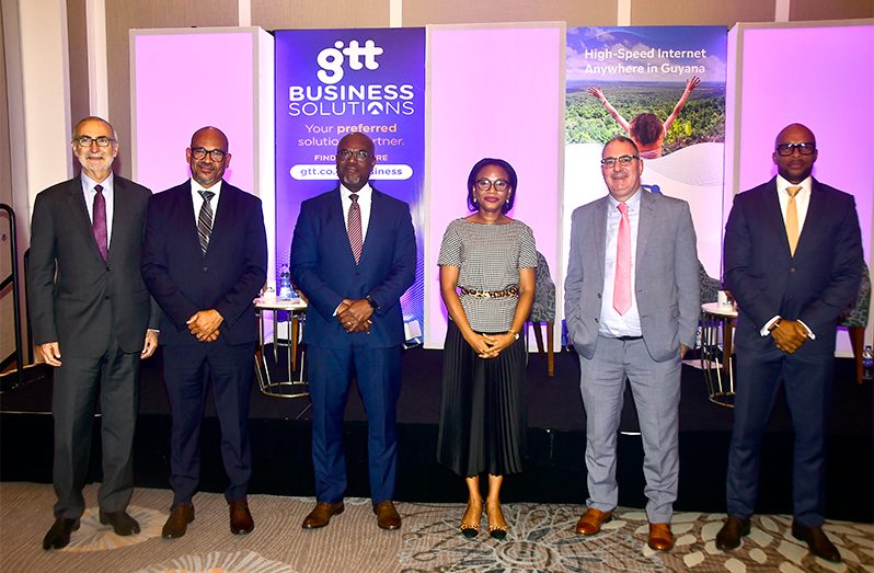 Stephen Spengler, Board member of WANSat Networks Inc.; William Mosely, WANSat COO; Andre Jones, CEO of WANSat; Oneidge Walrond, Minister of Tourism Industry and Commerce; Damian Blackburn, GTT CEO, and Orson Ferguson, COO GTT Business Solutions (Adrian Narine photo)