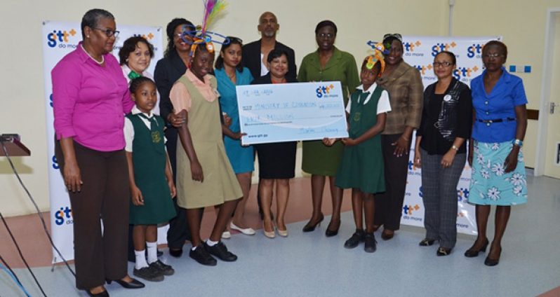 GTT marketing team presents the sponsorship cheque to their counterparts from the Ministry of Education