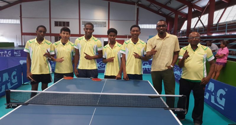 Team Guyana pose with the sport director Christopher Jones prior to departure.