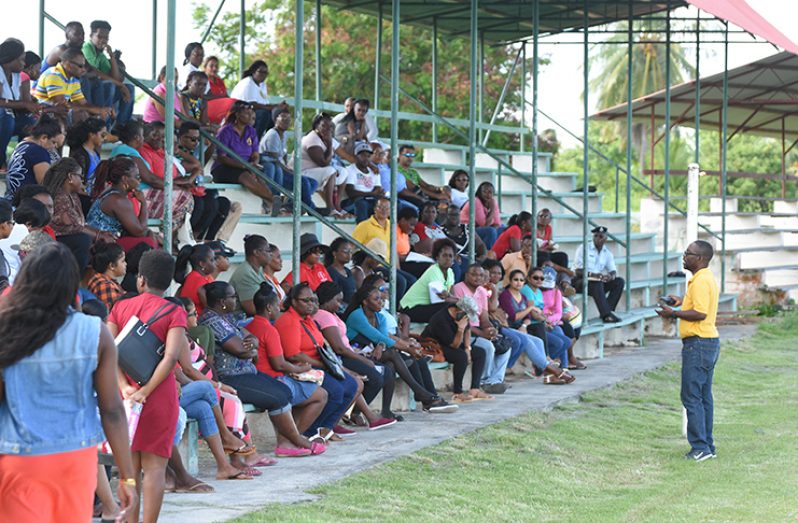 GTU President (right), speaking with teachers from the East Coast, at the Enmore Community Centre yesterday (Samuel Maughn photo)