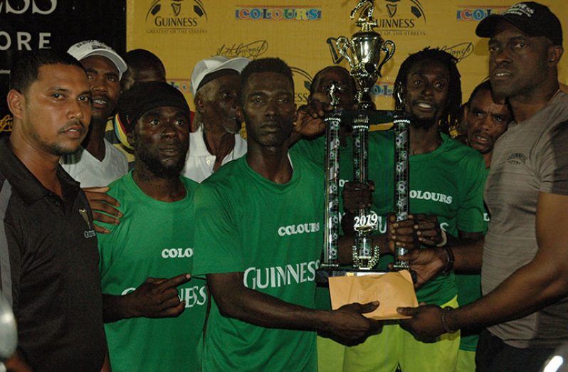 The West Demerara champions, Brothers United, pose with Guinness brand manager Lee Baptiste (right) after beating Showstoppers