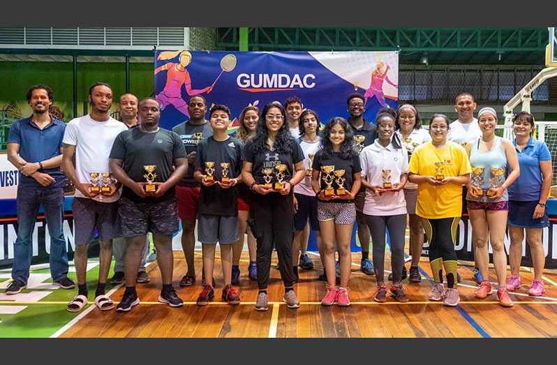 The respective winners with the sponsor and the Guyana Badminton Association officials.
