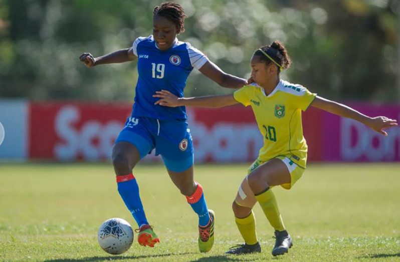Guyana’s Kiana Khedoo (#10), battling Haiti’s Maudeline Moryl during their quarter-finals at the CONCACAF U-20 Women’s Championship. (Photo compliments of CONCACAF)