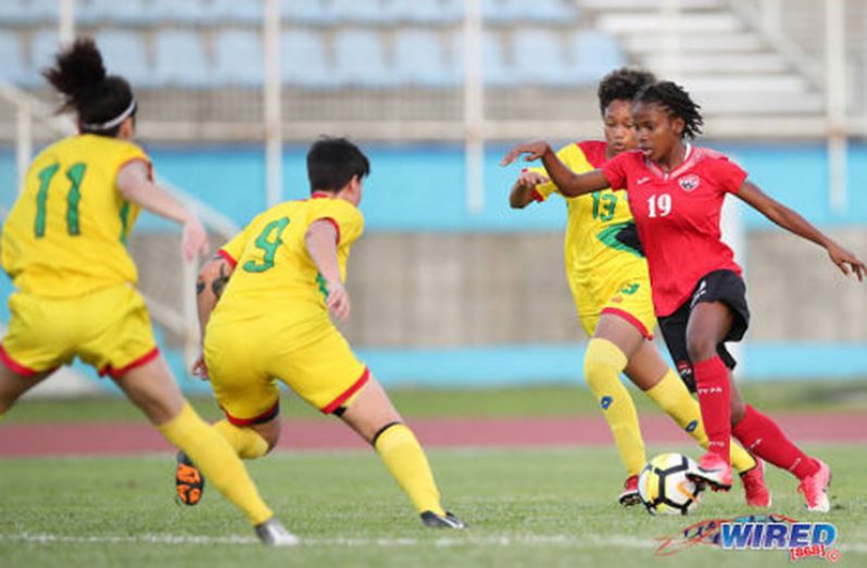 Trinidad and Tobago forward Aaliyah Prince (right) runs at the Guyana defence during CFU Challenge Series action at the Ato Boldon Stadium, Couva on April 29, 2018. (Credit: Allan V Crane/CA-Images/Wired868)