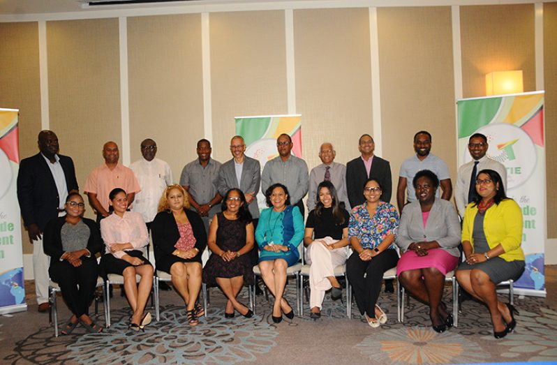 Minister of Business, Dominic Gaskin (fifth left), shares a photograph with the sponsors and partners of the upcoming GuyTIE event on Wednesday at the Marriott Hotel (Adrian Narine photo)