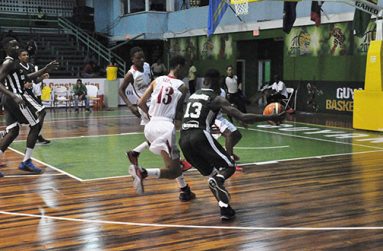 Kevon Wiggins pushes the ball for Guyana.