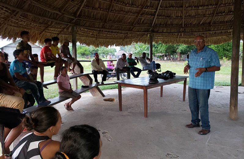 Managing Director of GWI, Dr. Richard Van-West Charles, during a discussion with residents in the North Rupununi