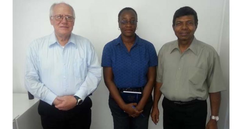 Dr Edgar Paski poses with GWI Scientific Services Manager, Donna Canterbury, accompanied by GWI Chief Executive Officer, Shaik Baksh