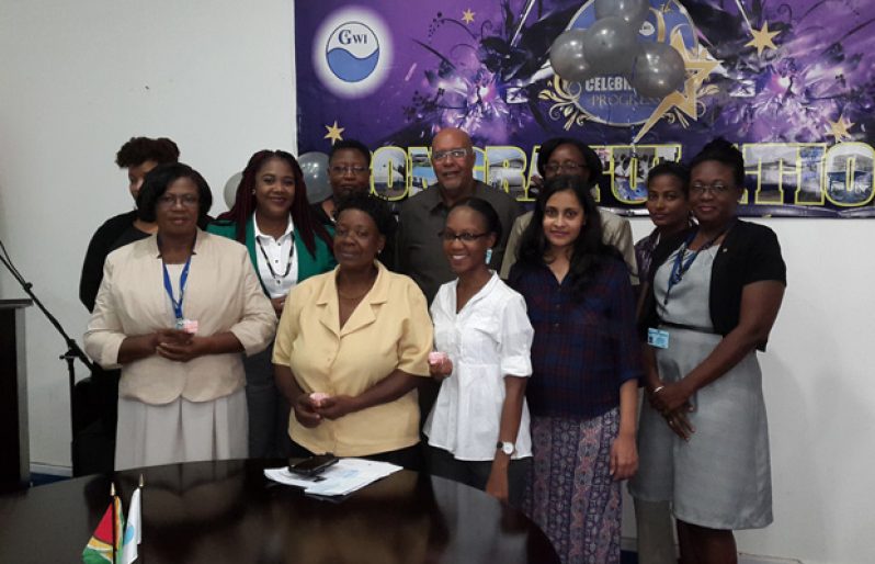 CEO of GWI, Dr. Richard Van West-Charles (centre) flanked by the women who received tokens of appreciation during International Women’s Day observance yesterday.