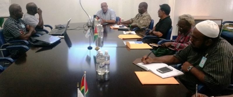 GWI CEO Dr. Van West-Charles speaking with representatives of hospitals in Georgetown