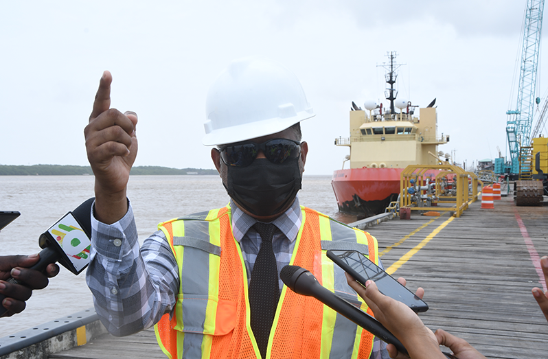 Minister within the Ministry of Public Works, Deodat Indar, speaking to the media at the construction site - Adrian Narine Photo
