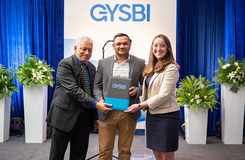 (From Left to Right) Executive Director of GYSBI, Robin Muneshwer, Minister of Natural Resources, Vickram Bharrat and ExxonMobil Guyana’s Logistics Manager, Hayley Gilbert, following the signing of the contract on Saturday 
Base: Today, GYSBI stands at 170 acres, has eight warehouses and four berths, with further expansions planned