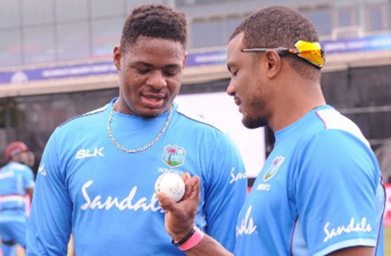 Shannon Gabriel (right) makes a point to fellow speedster Oshane Thomas during a practice session in Bristol last weekend. (Photo courtesy CWI Media)