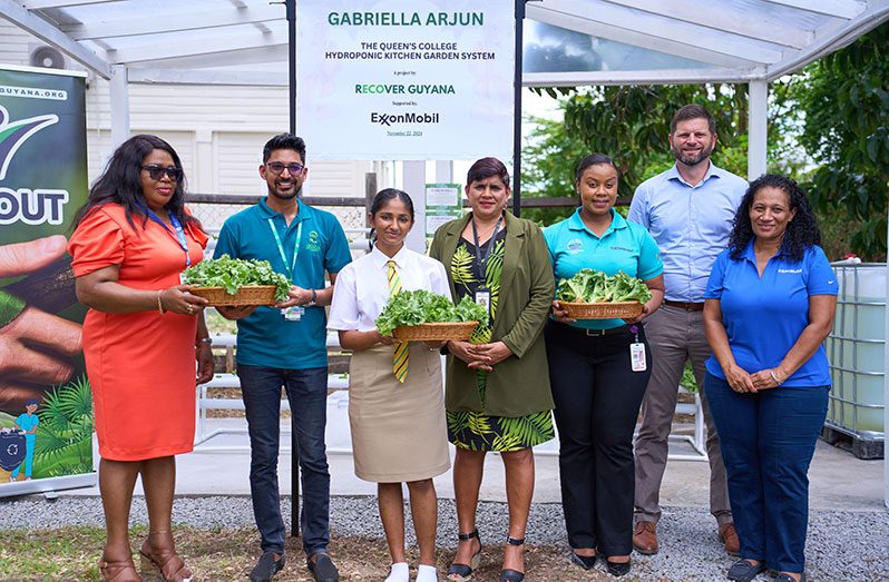 Celebrating the first harvest of the Queen’s College Hydroponic Kitchen Garden System. L-R: Mrs. Marcia Paddy-Andrews, Assistant Chief Education Officer for Technical Education; Dr. Dave Lalltoo, President, Recover Guyan; Gabriella Arjun, Guyana Youth Environmental Speaker 2024; Mrs. Kumarie Lall, Headteacher, Queen’s College; Ms. Lasawhna Prescott, Community Relations Advisor, ExxonMobil Guyana; Ms. Lorraine Ince, Communications Specialist, ExxonMobil Guyana and Mr. Mathew Scharf, Public and Government Affairs Manager, ExxonMobil Guyana