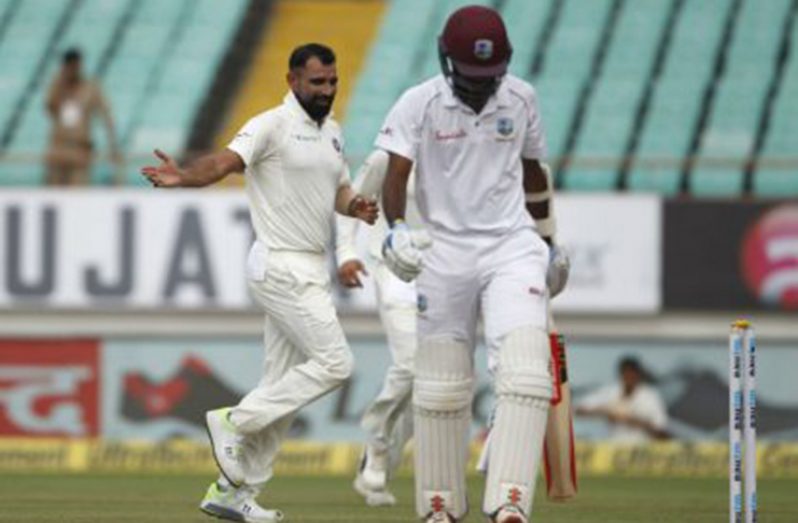 West Indies opener Kraigg Brathwaite walks away after he was bowled by Mohammed Shami on the second day of the opening Test.