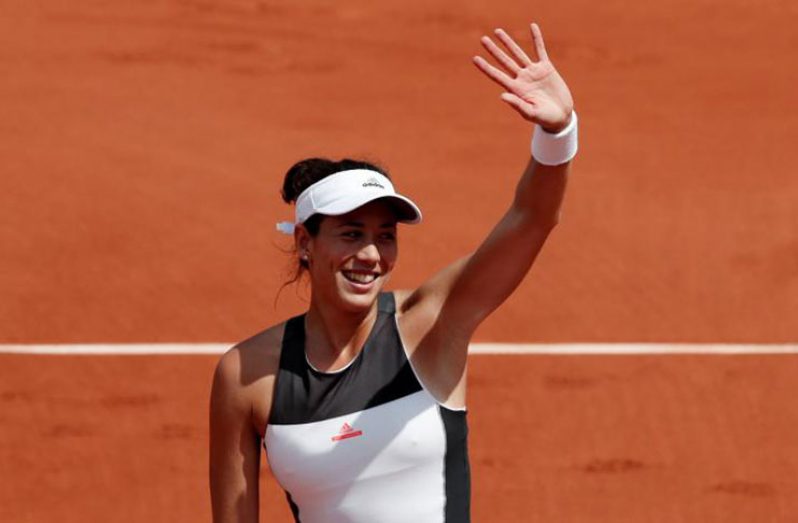 Spain's Garbine Muguruza celebrates after winning her second-round match against Estonia's Anett Kontaveit. (Reuters/Benoit Tessier)