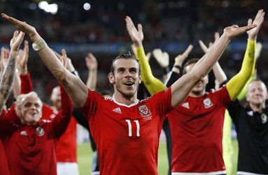 Gareth Bale leads the Welsh celebrations. (Reuters)