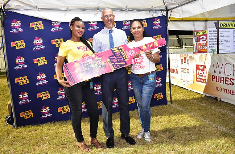 Honourable Minister of Business, Dominic Gaskin, during his visit to the Women’s World T20 booth at the Berbice Expo on Friday night at Albion. (WWT20||JohnRamsingh photo)