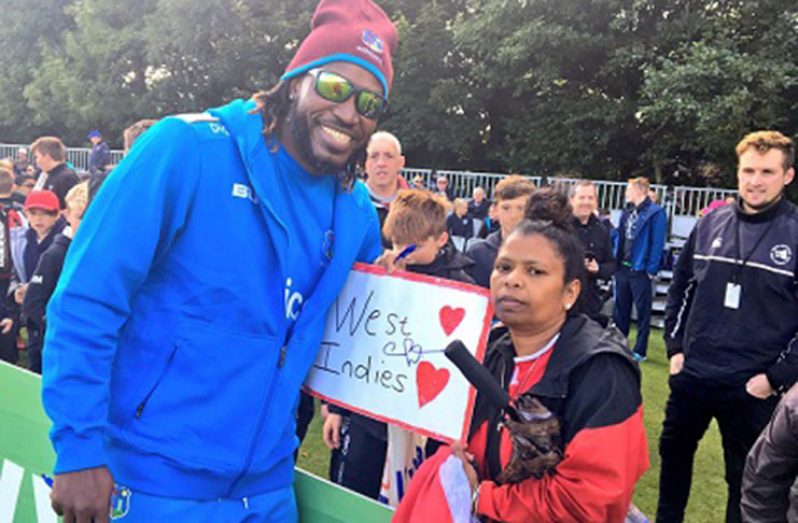 Superstar opener Chris Gayle poses with a fan during the abandoned ODI against Ireland. (Photo courtesy CWI Media)
