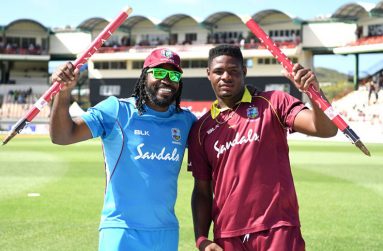 Chris Gayle and Oshane Thomas celebrate winning the 5th ODI v England at St Lucia yesterday. (Getty Images)