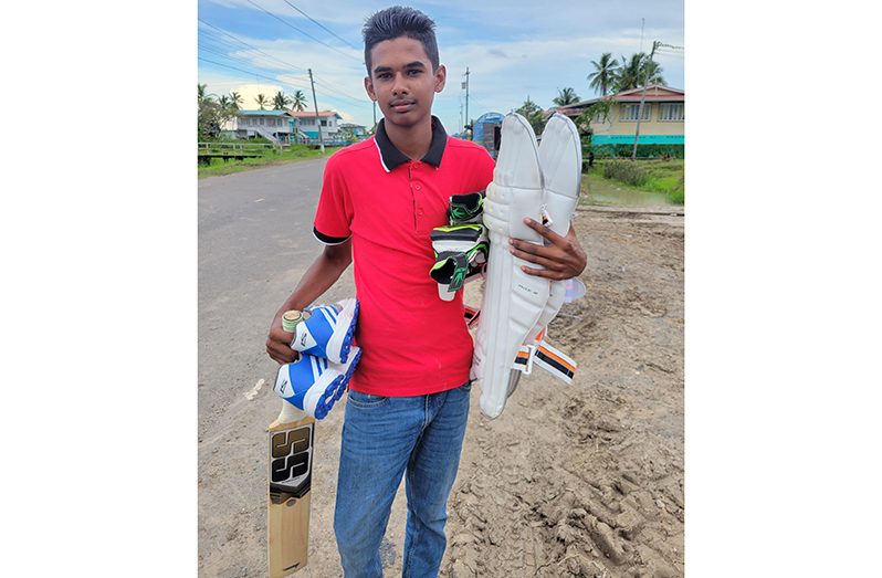 Dakshanarainsamy Narainsamy poses with the cricket gear.