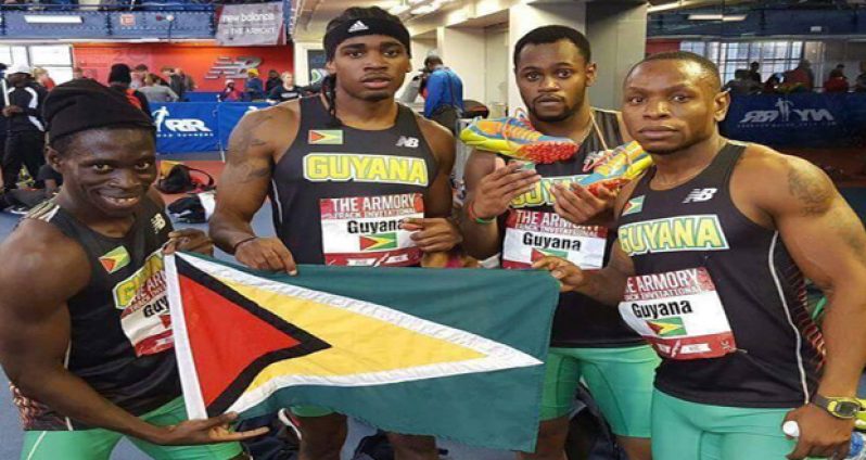 The Guyana men's team at the Armory Invitational show off their flag, from left, Winston George, Earl Lucas, Chavez Ageday and jeremy Bascom