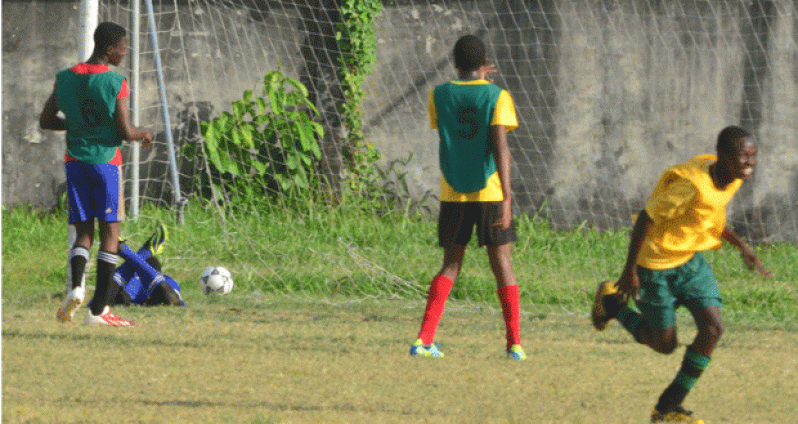 Chronicle Sport’s Adrian Narine was on hand to witness one of the two first-half goals being scored by St George’s Roddy McGloggan (not in picture), during his team’s semifinal matchup against Bishops’ High yesterday.