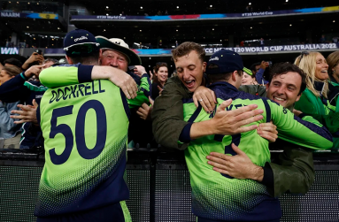George Dockrell and Lorcan Tucker get big hugs from the crowd. (ICC via Getty Images)