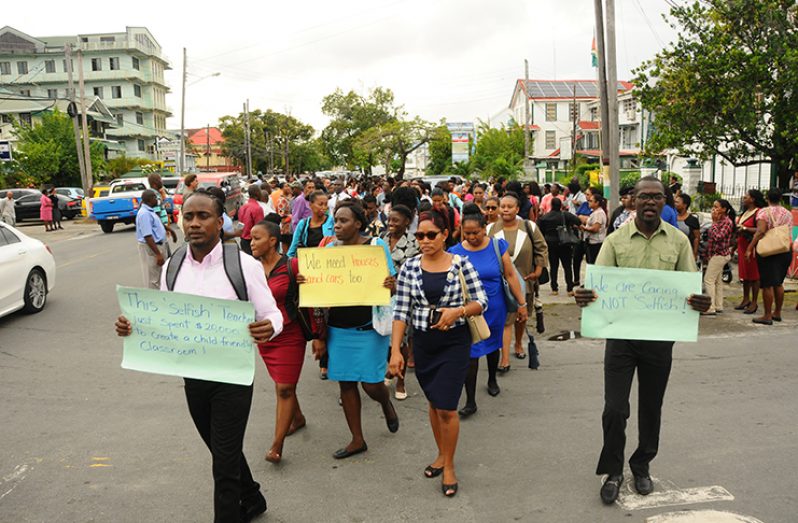 Hundreds of teachers marched down the streets of Georgetown to express their concerns (Adrian Narine photo)