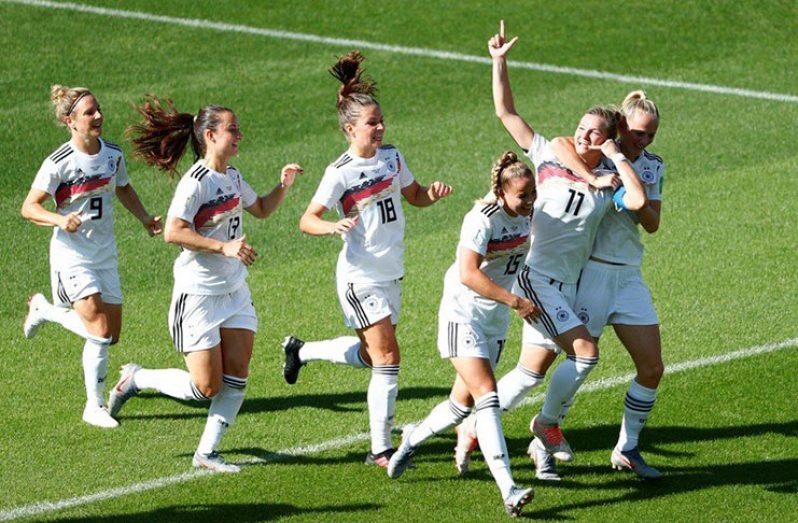 Germany's Alexandra Popp celebrates scoring their first goal with teammates at Grenoble, France.   (REUTERS/Emmanuel FoudrotReuters)