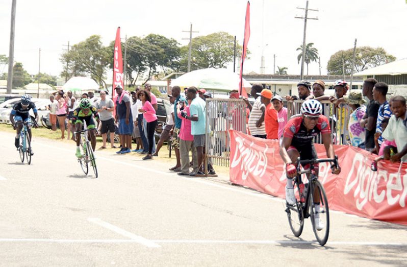 Geron Williams surges to victory to win the Digicel/Evolution Cancer Awareness feature cycle road race yesterday (Photos by Adrian Narine)