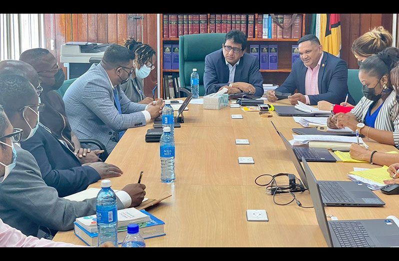 Attorney-General and Minister of Legal Affairs, Anil Nandlall, SC, (left), and Minister of Natural Resources, Vickram Bharrat (right), along with other local stakeholders, engage members of a high-level team from Ghana, on Wednesday