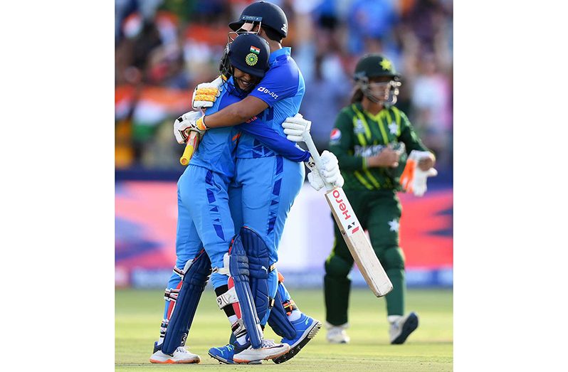 Jemimah Rodrigues and  Richa Ghosh embrace after sealing victory