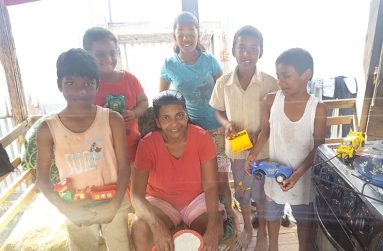 Ramdeo and her grandchildren posing